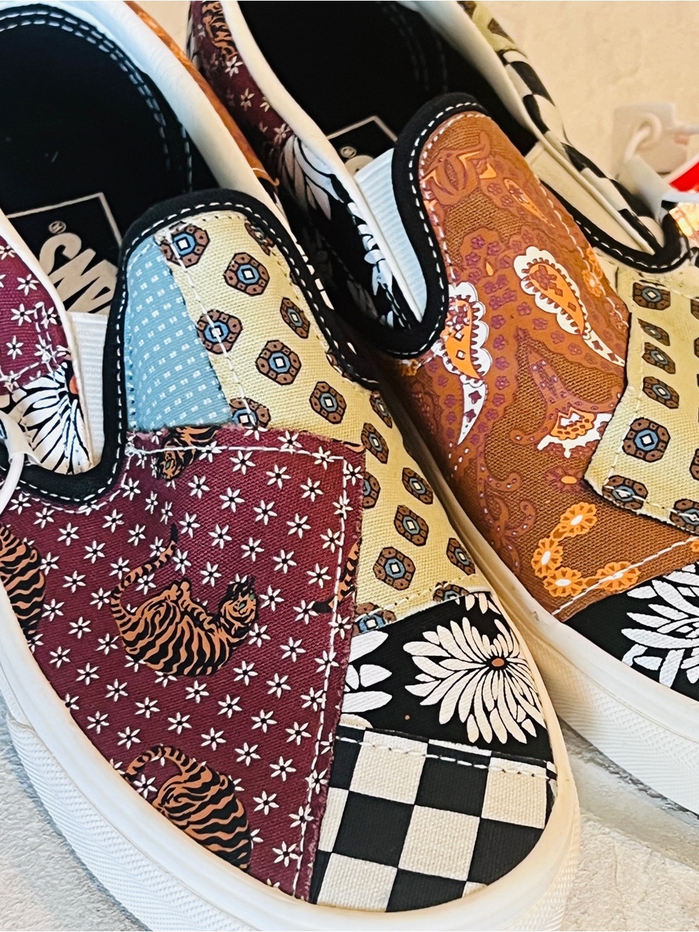 Vans classic slip ons in tiger patchwork. NWT Women’s size 7.5